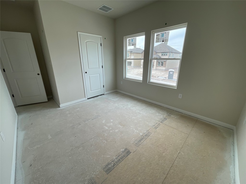 604 Palo Brea Loop Hutto, TX 78634 - Photo 31 of 36 an empty room with windows