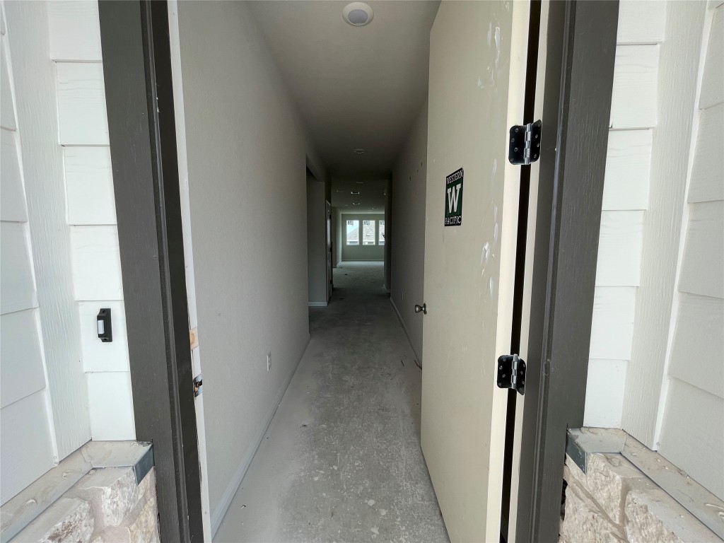604 Palo Brea Loop Hutto, TX 78634 - Photo 5 of 36 a view of a hallway with wooden floor and closet