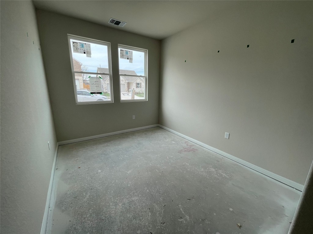 604 Palo Brea Loop Hutto, TX 78634 - Photo 8 of 36 an empty room with windows