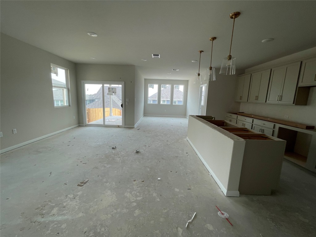 604 Palo Brea Loop Hutto, TX 78634 - Photo 10 of 36 a view of an empty room with a window