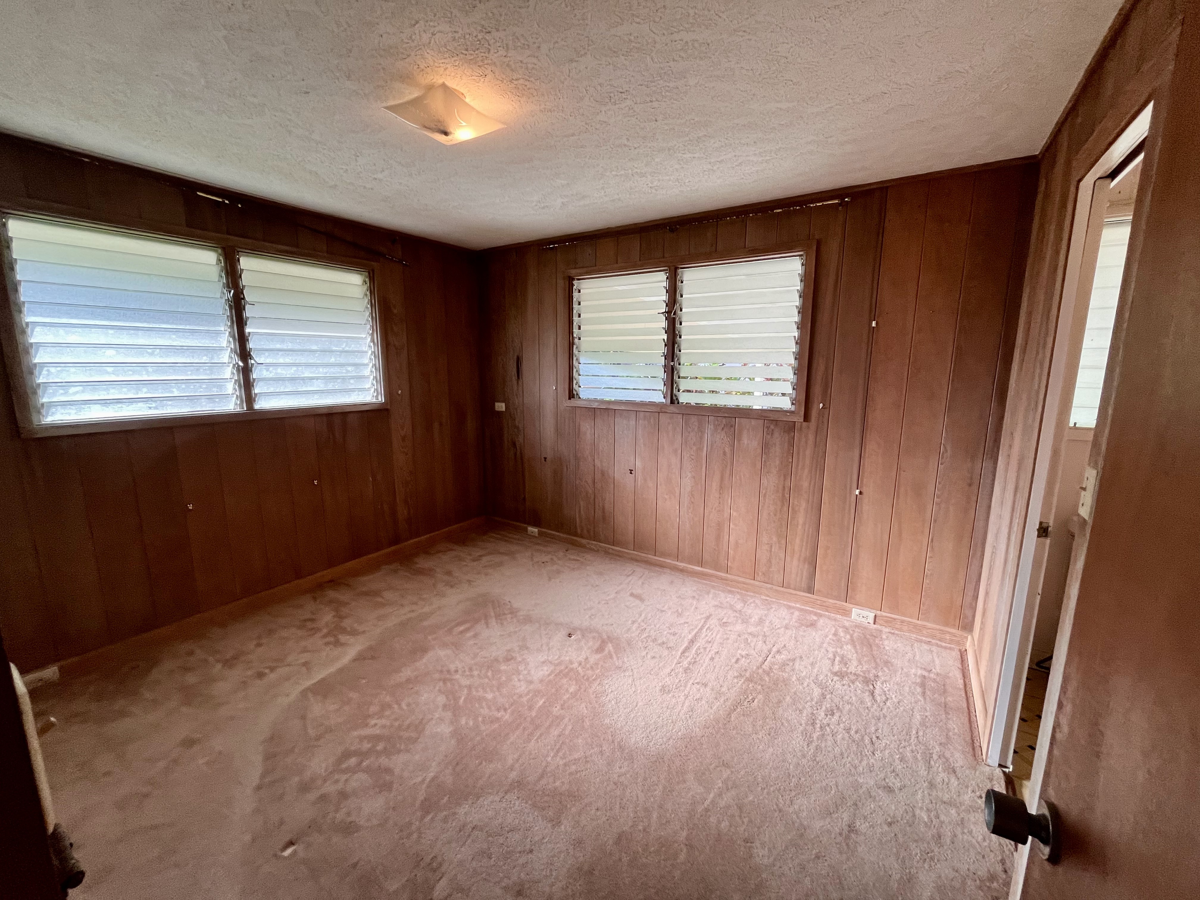 106 Laula Road Hilo, HI 96720 - Photo 15 of 30 an empty room with windows