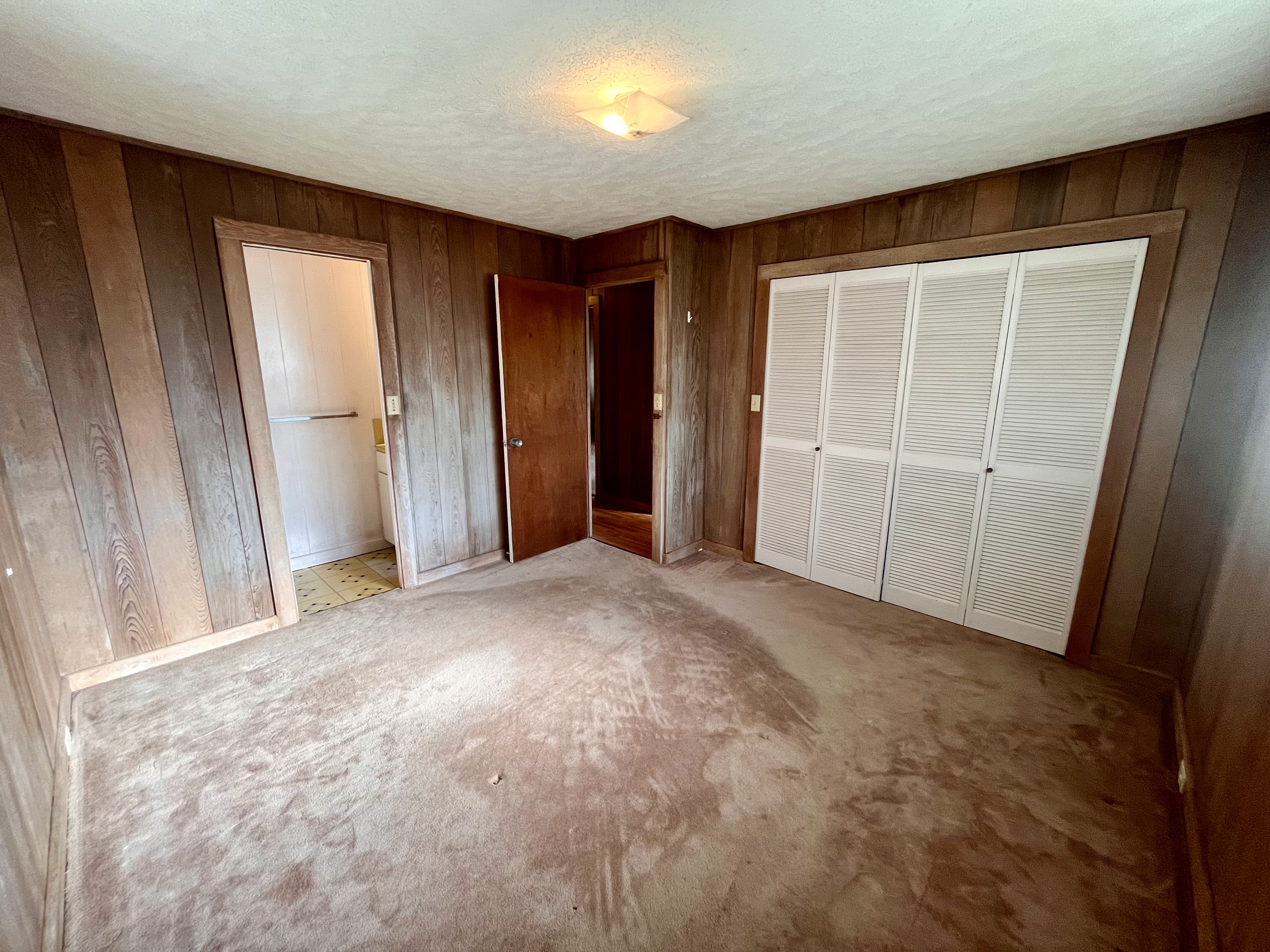 106 Laula Road Hilo, HI 96720 - Photo 17 of 30 an empty room with closet and wooden floor