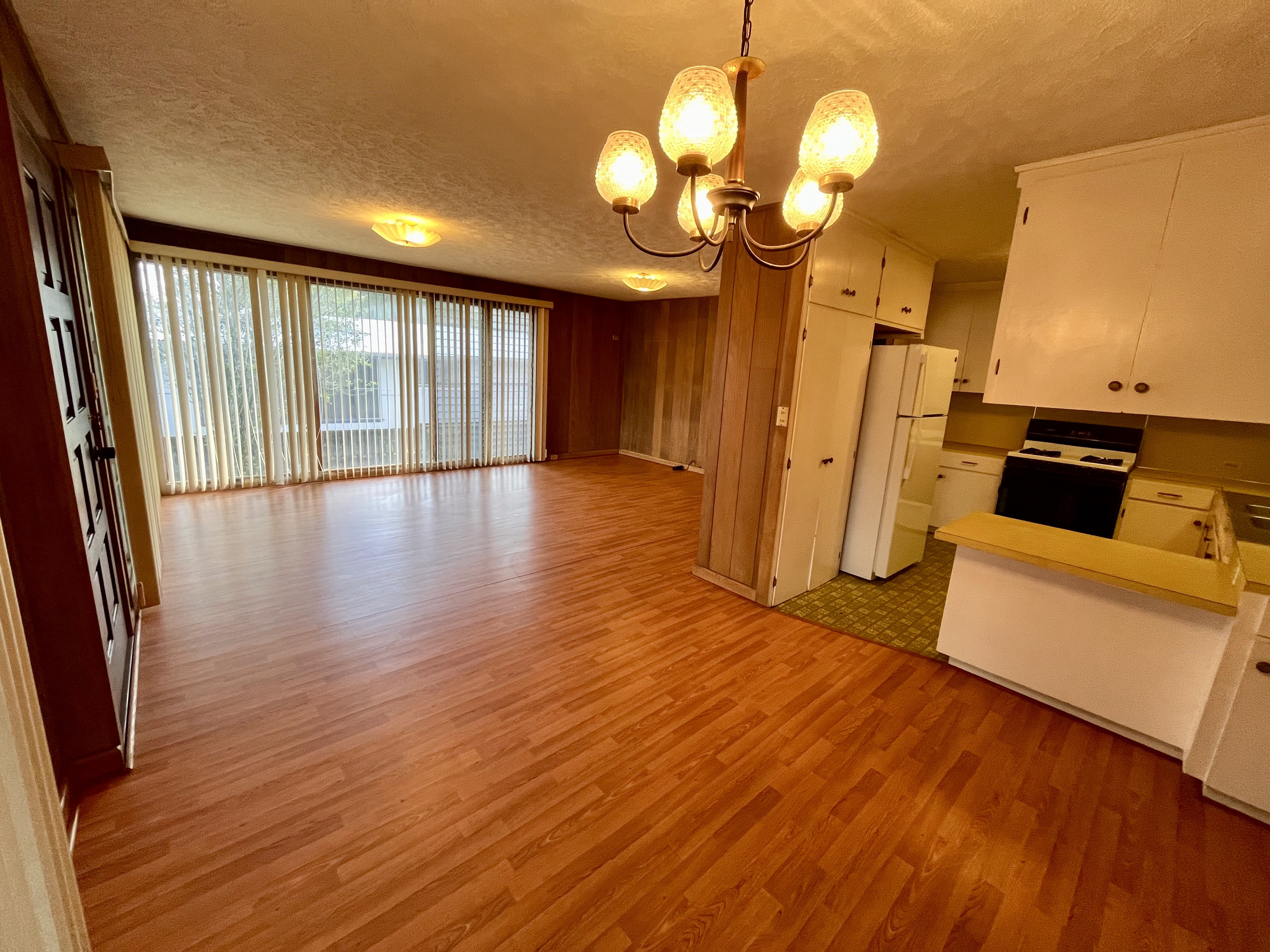106 Laula Road Hilo, HI 96720 - Photo 5 of 30 a view of a livingroom with furniture wooden floor and a large window