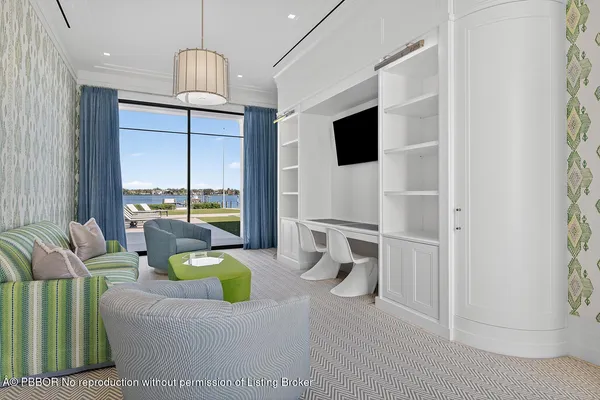 a front view of a house with a yard and swimming pool