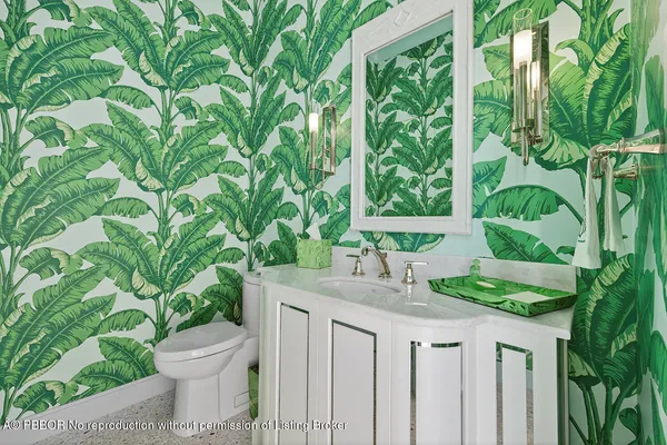 a bathroom with a sink and mirror