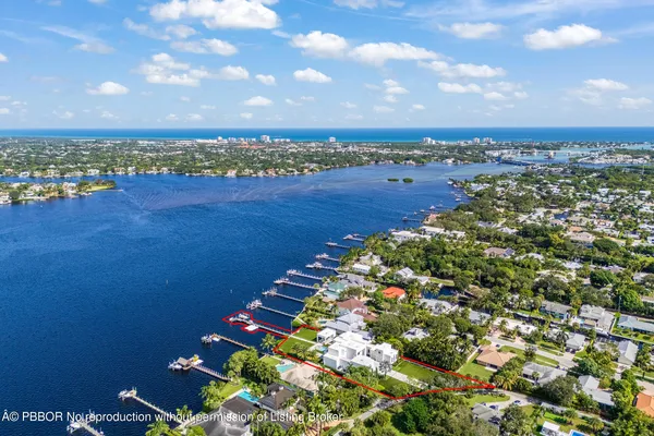 a view of a house with swimming pool and porch