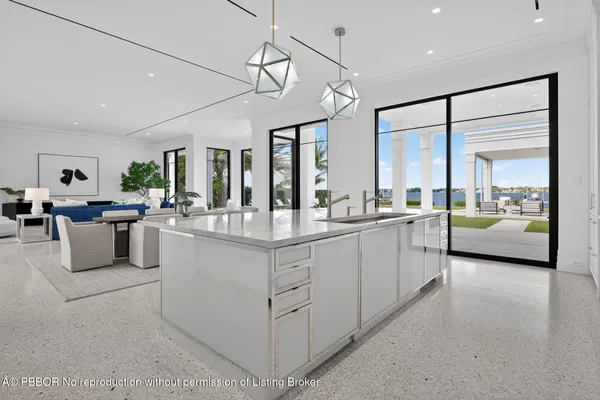 a bedroom with a large bed and a large window