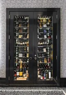 a bathroom with a double vanity sink toilet mirror and shower