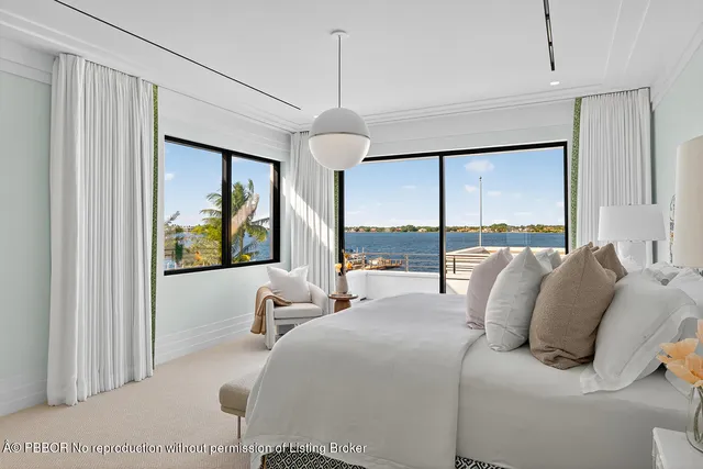 a kitchen with white cabinets and table