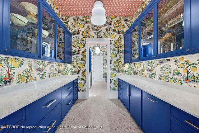 a view of swimming pool with large trees and couches chairs