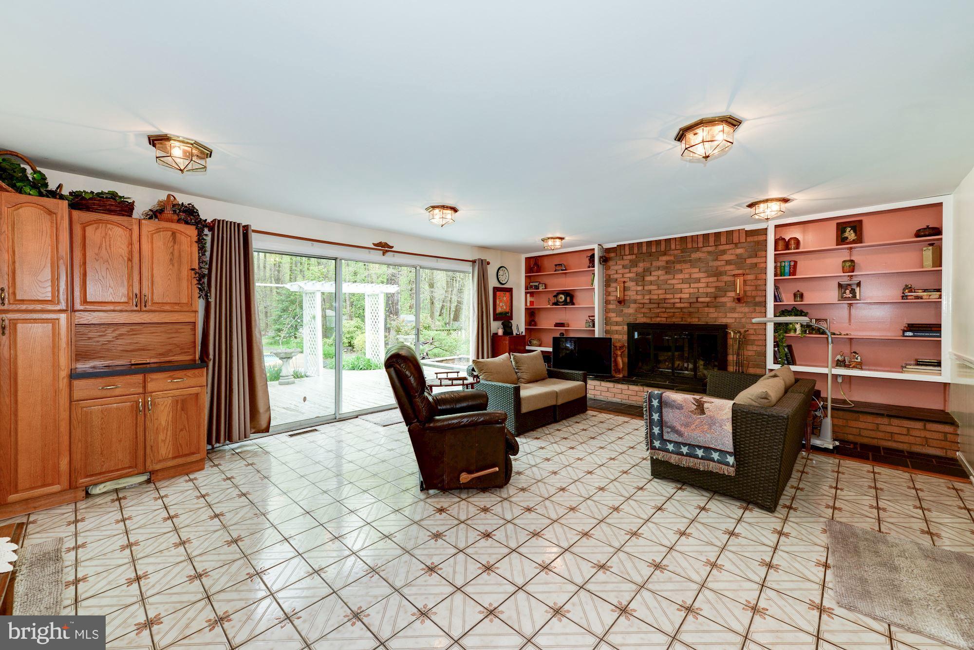 6016 Chapman Road Lorton, VA 22079 - Photo 16 of 47 HUUUGE Rec Room opens to the garage and deck.