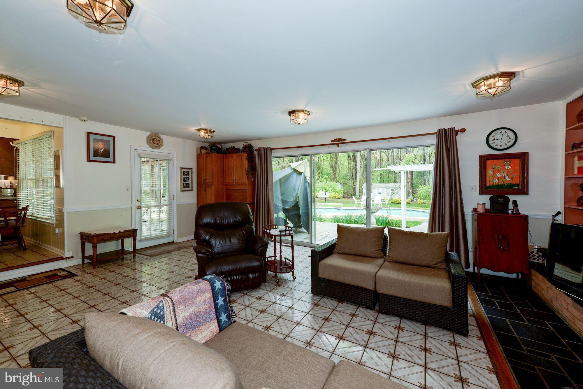6016 Chapman Road Lorton, VA 22079 - Photo 17 of 47 Wood fireplace makes rec room toasty warm!