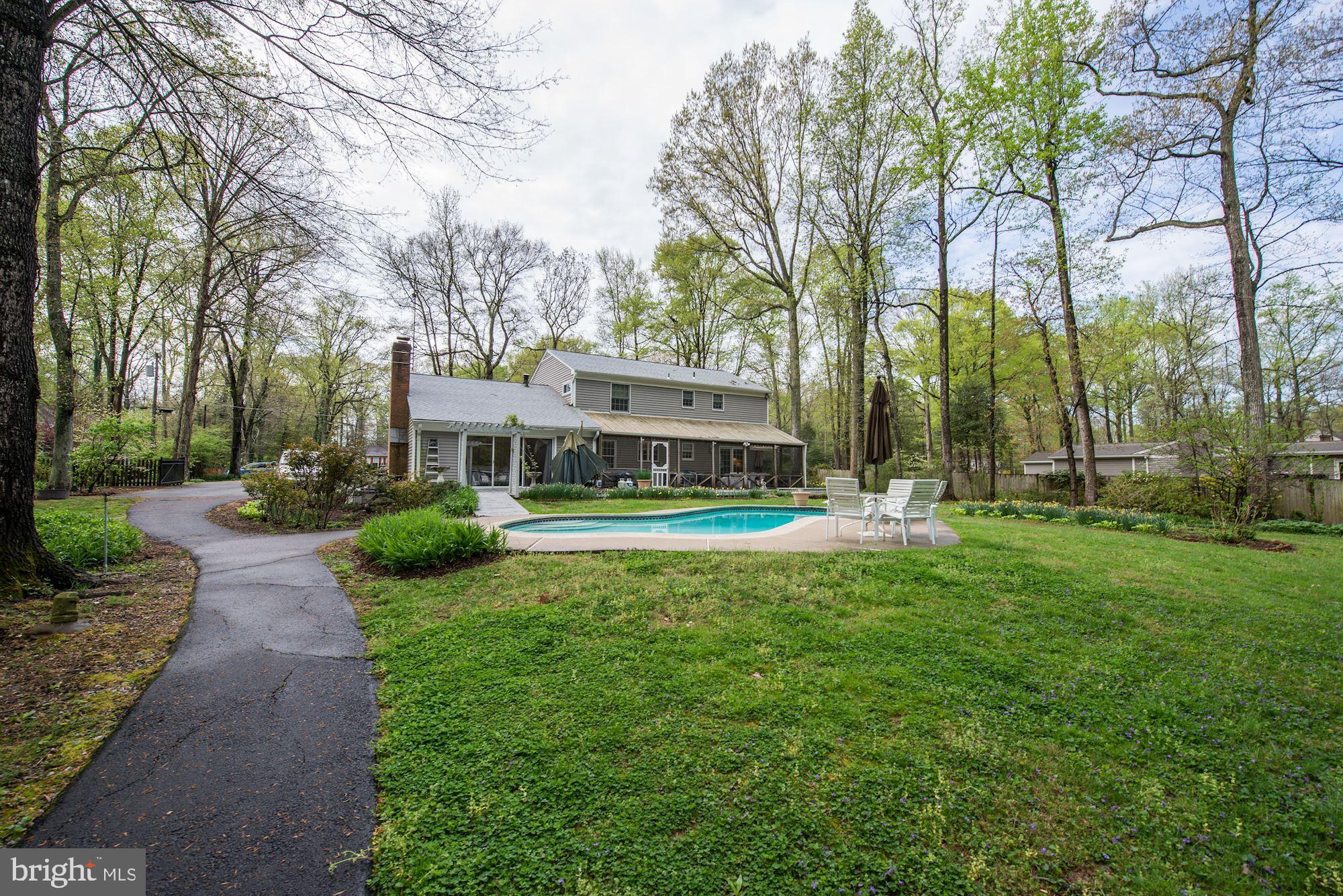 6016 Chapman Road Lorton, VA 22079 - Photo 30 of 47 Walking blacktop curves through back yard.