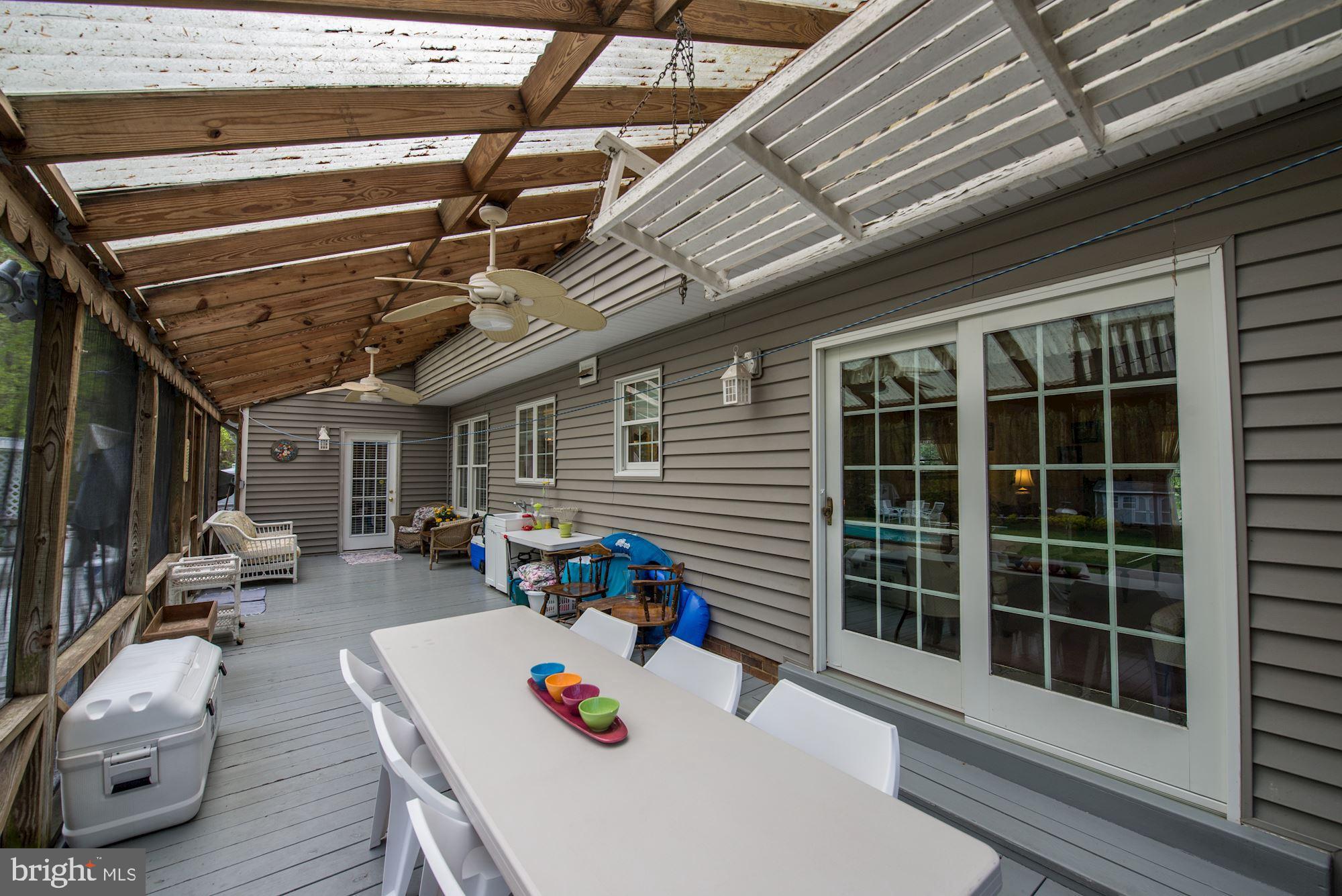 6016 Chapman Road Lorton, VA 22079 - Photo 37 of 47 Spend cool summer evenings on the screened porch.
