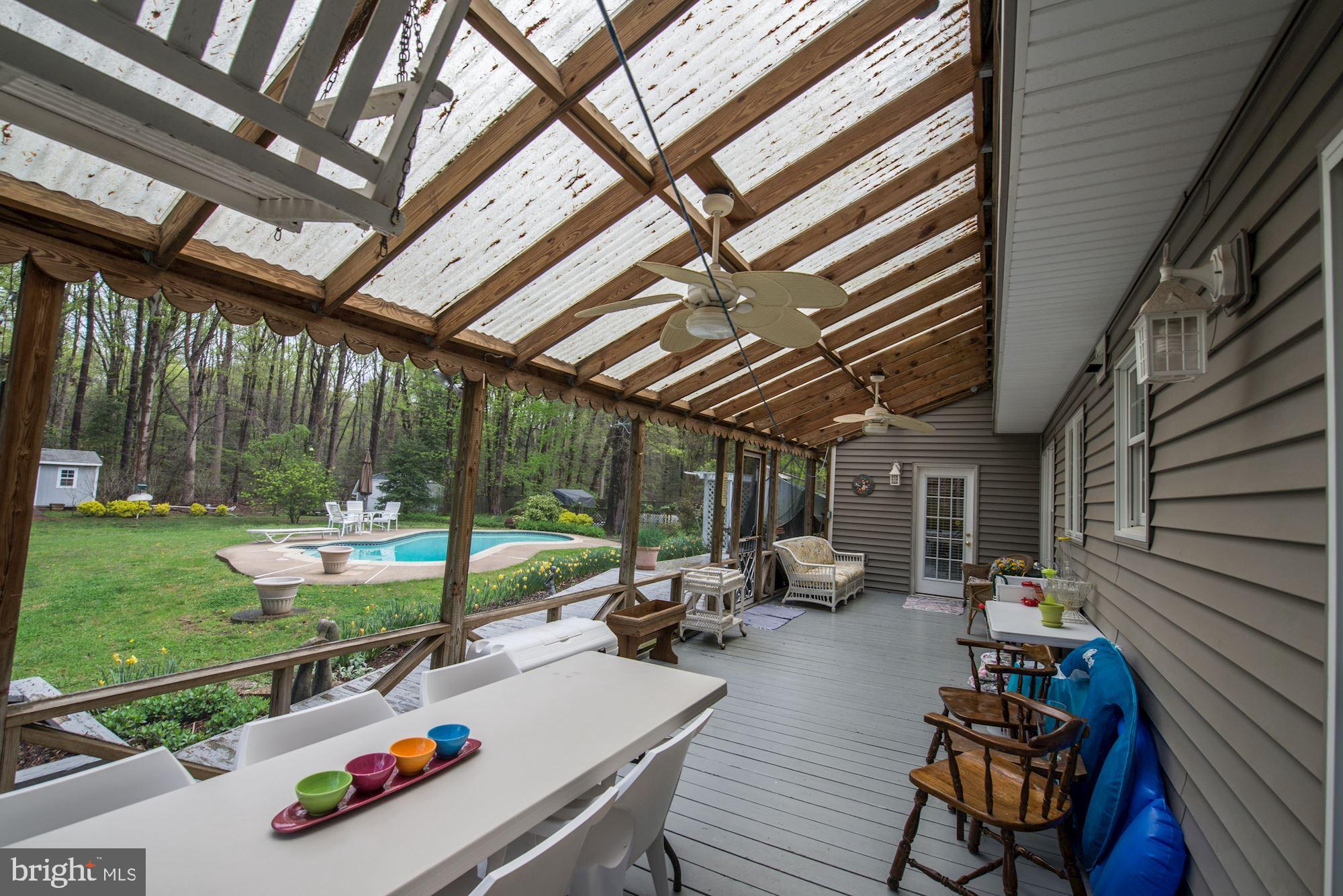 6016 Chapman Road Lorton, VA 22079 - Photo 38 of 47 Screen porch w/ ceiling fans, views of the pool.
