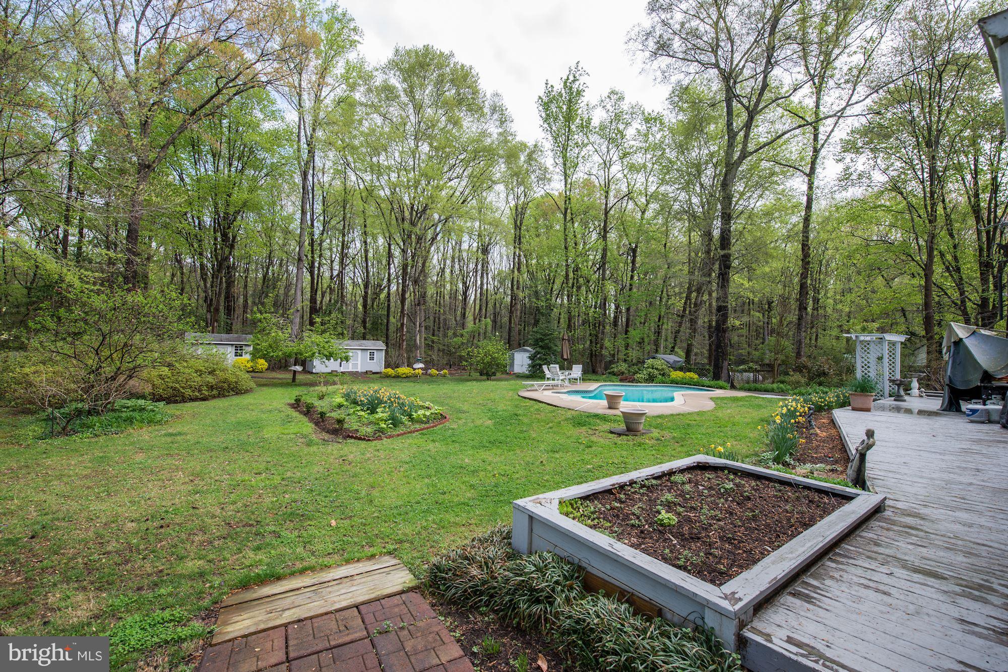 6016 Chapman Road Lorton, VA 22079 - Photo 41 of 47 Deck wraps across the whole house in backyard.