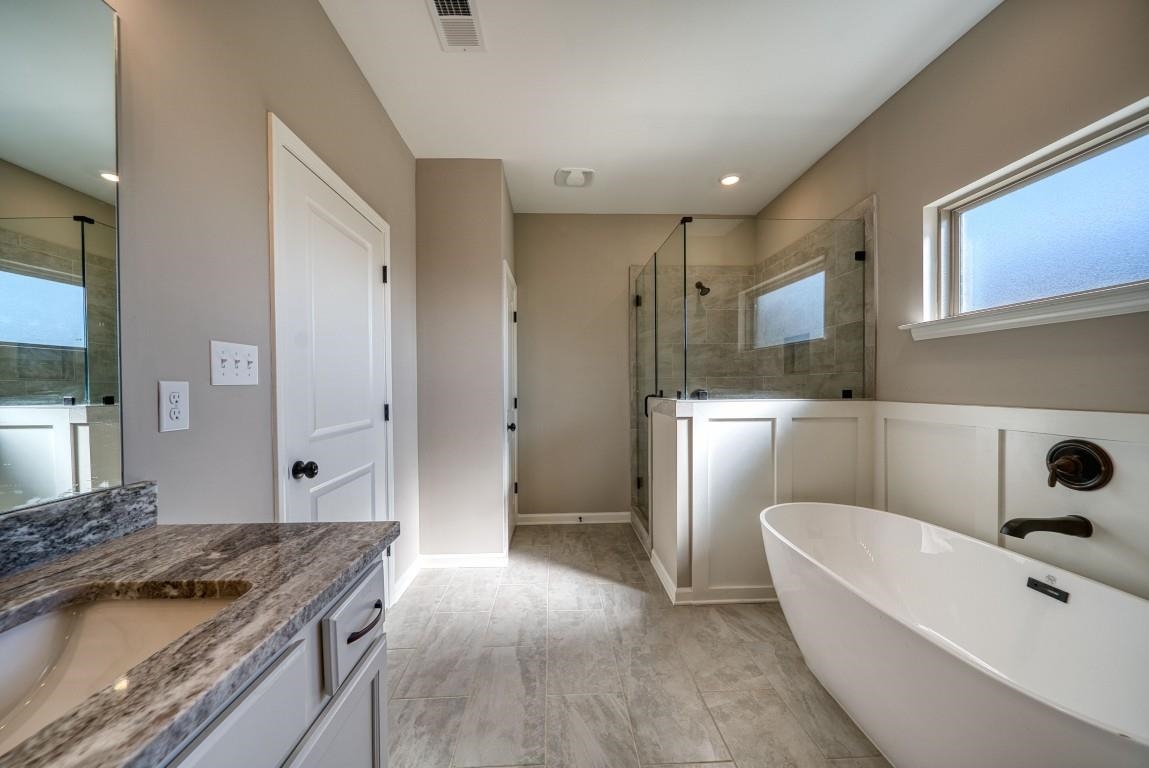 142 Como Lane Atoka, TN 38004 - Photo 10 of 33 a bathroom with a granite countertop sink a toilet a mirror and shower
