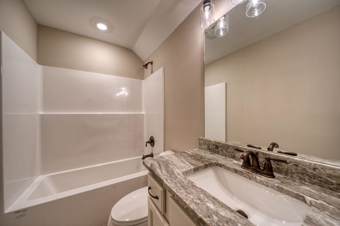 142 Como Lane Atoka, TN 38004 - Photo 29 of 33 a bathroom with a granite countertop sink toilet and shower