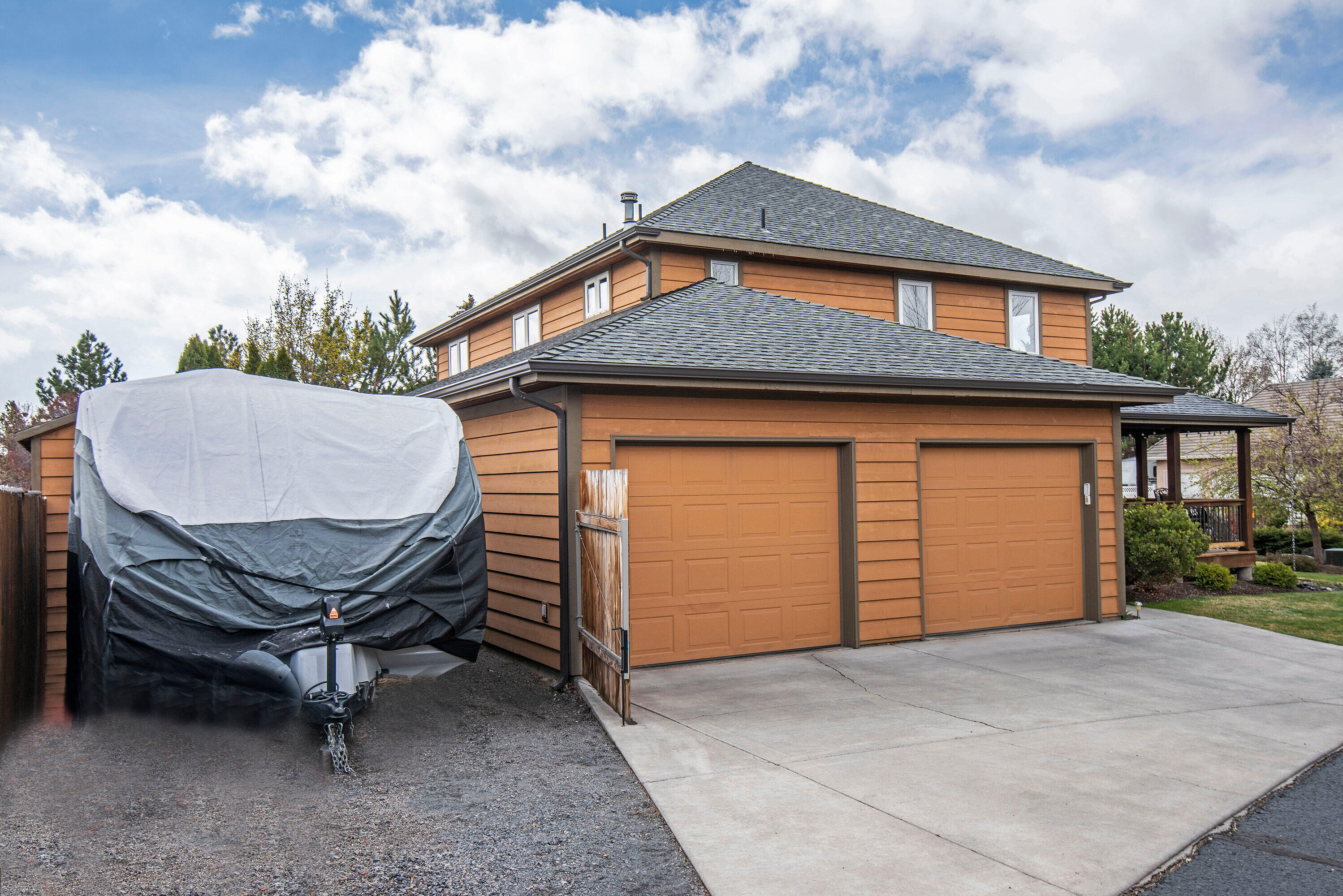 3357 Northeast Stonebrook Loop Bend, OR 97701 - Photo 23 of 26 a backyard of a house with barbeque oven and wooden fence