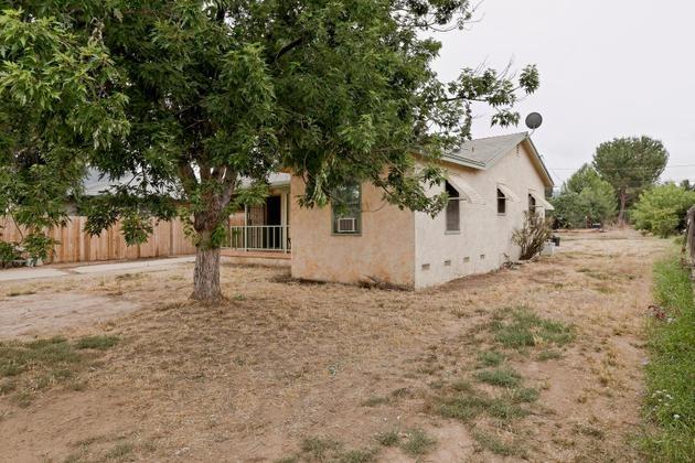 210 Sunset Avenue Oak View, CA 93022 - Photo 11 of 15 a white house that has a tree in front of it
