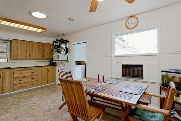 210 Sunset Avenue Oak View, CA 93022 - Photo 5 of 15 a kitchen with a table chairs and a refrigerator