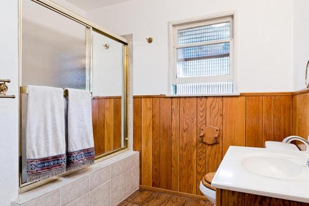 210 Sunset Avenue Oak View, CA 93022 - Photo 9 of 15 a bathroom with a sink a mirror and a shower