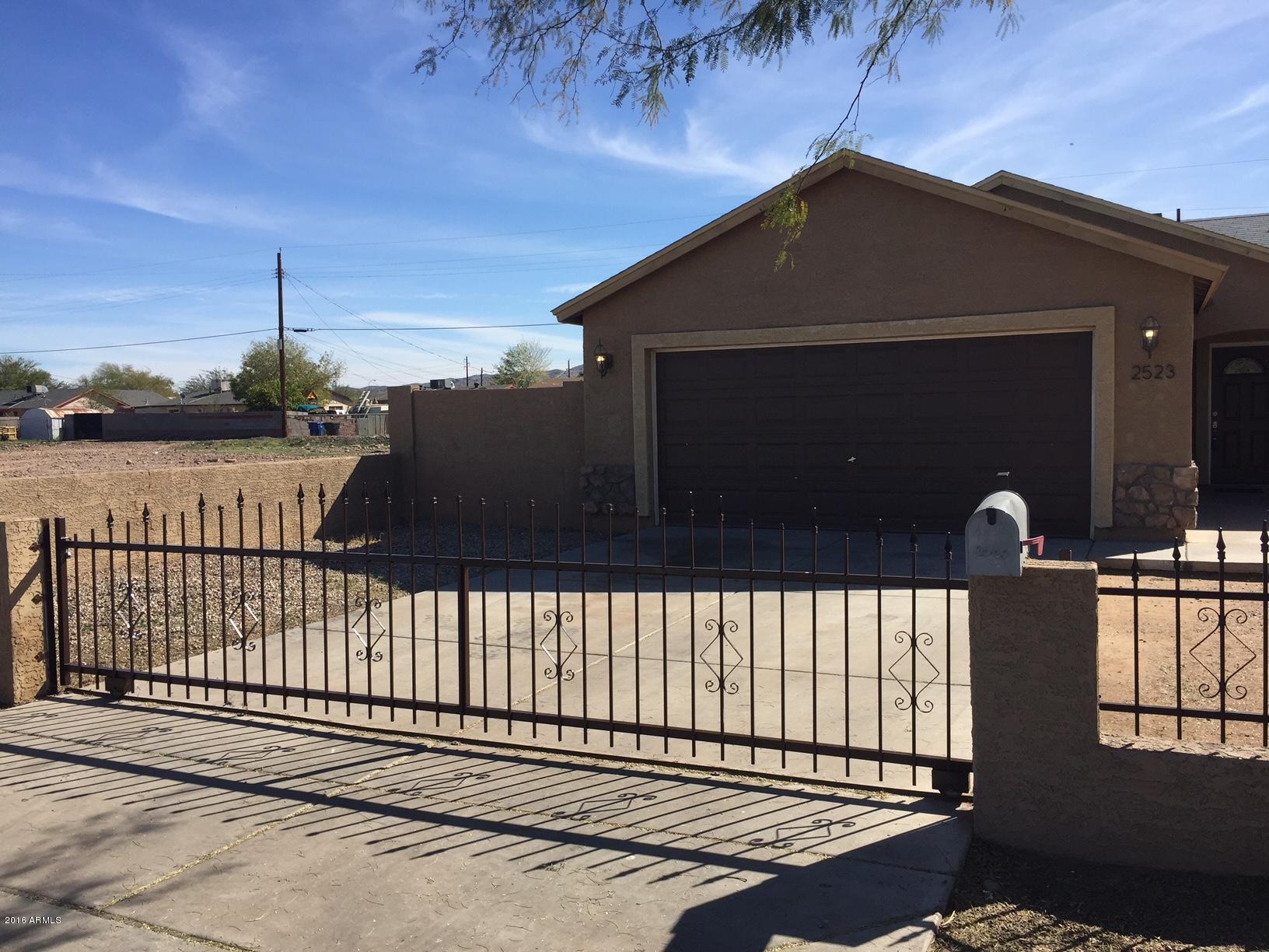 2523 East Chipman Road Phoenix, AZ 85040 - Photo 17 of 18 sliding wrought-iron security gate to dr