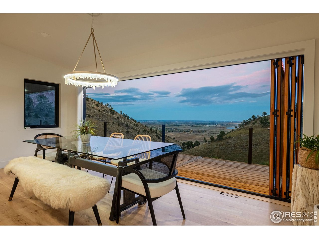5880 Olde Stage Road Boulder, CO 80302 - Photo 2 of 50 a balcony with table and chairs