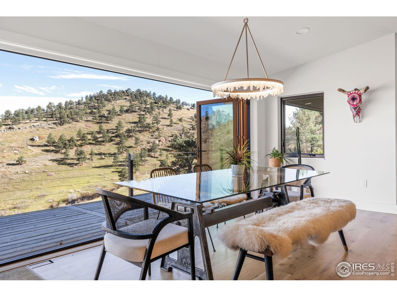 5880 Olde Stage Road Boulder, CO 80302 - Photo 22 of 50 a view of a dining room with furniture window and outside view