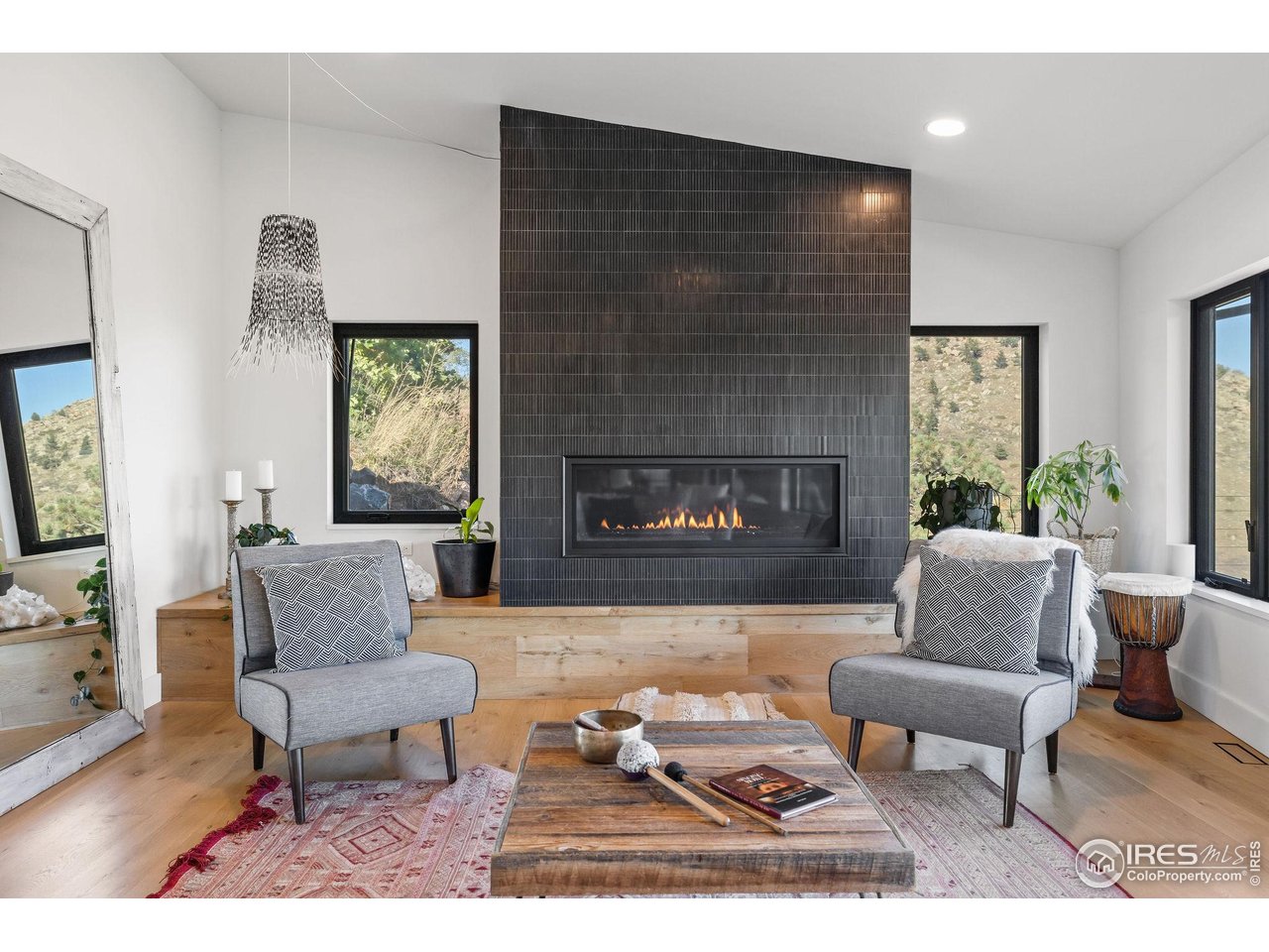5880 Olde Stage Road Boulder, CO 80302 - Photo 25 of 50 a living room with furniture and a fireplace