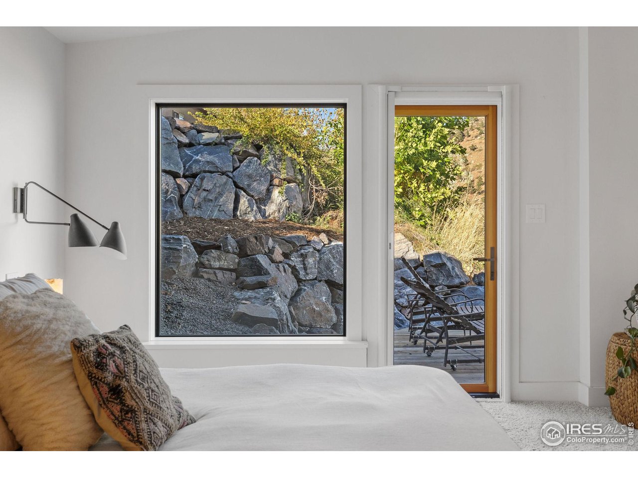 5880 Olde Stage Road Boulder, CO 80302 - Photo 27 of 50 a view of a bedroom with furniture and window