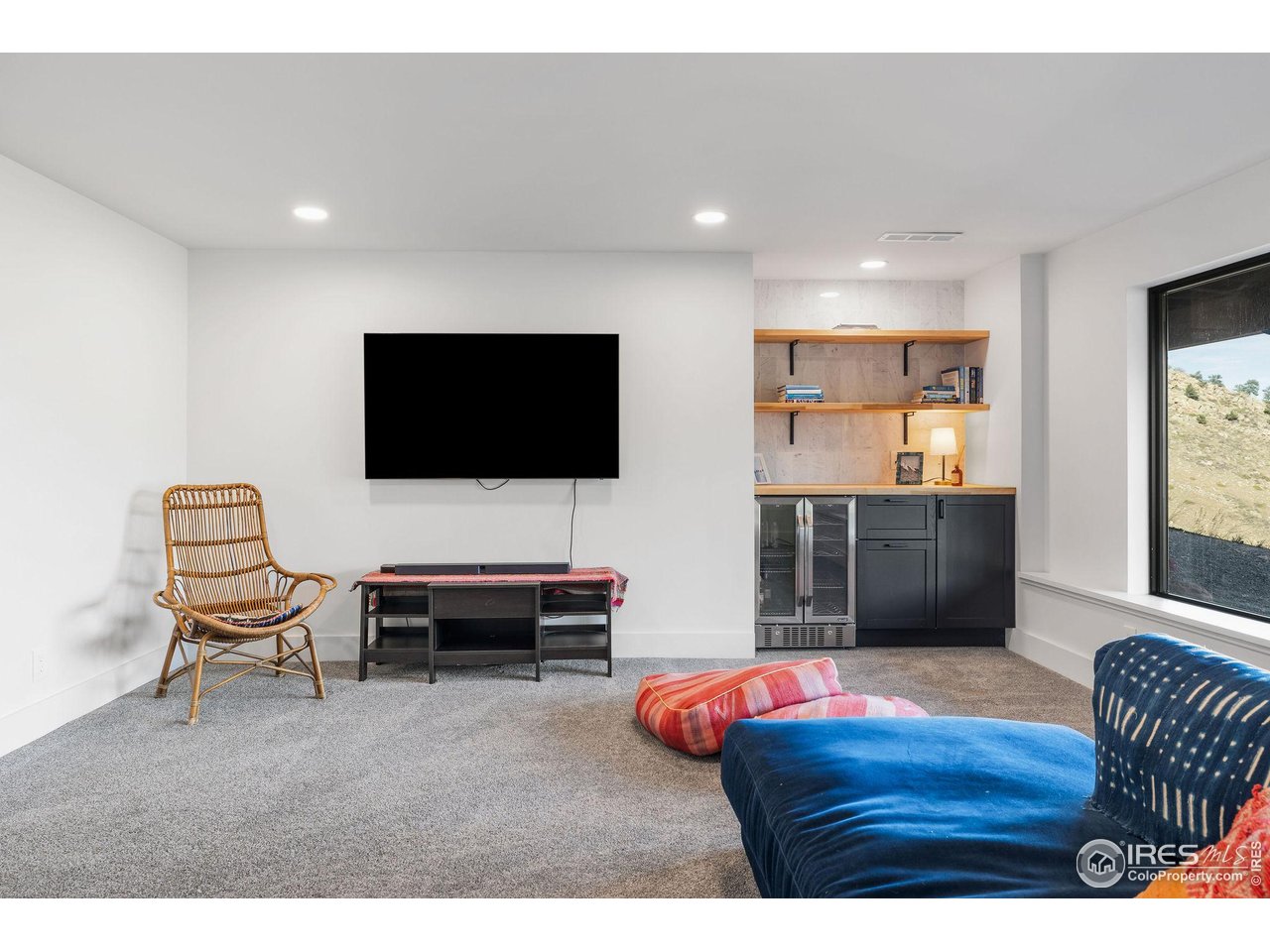 5880 Olde Stage Road Boulder, CO 80302 - Photo 40 of 50 a living room with furniture and a flat screen tv