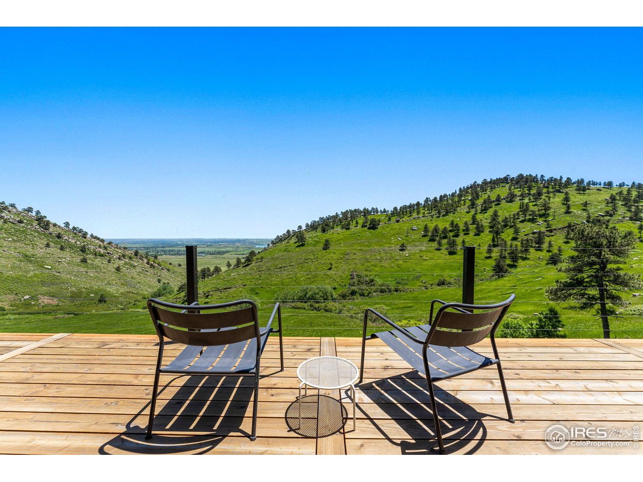 5880 Olde Stage Road Boulder, CO 80302 - Photo 45 of 50 a view of a chairs and table on the terrace