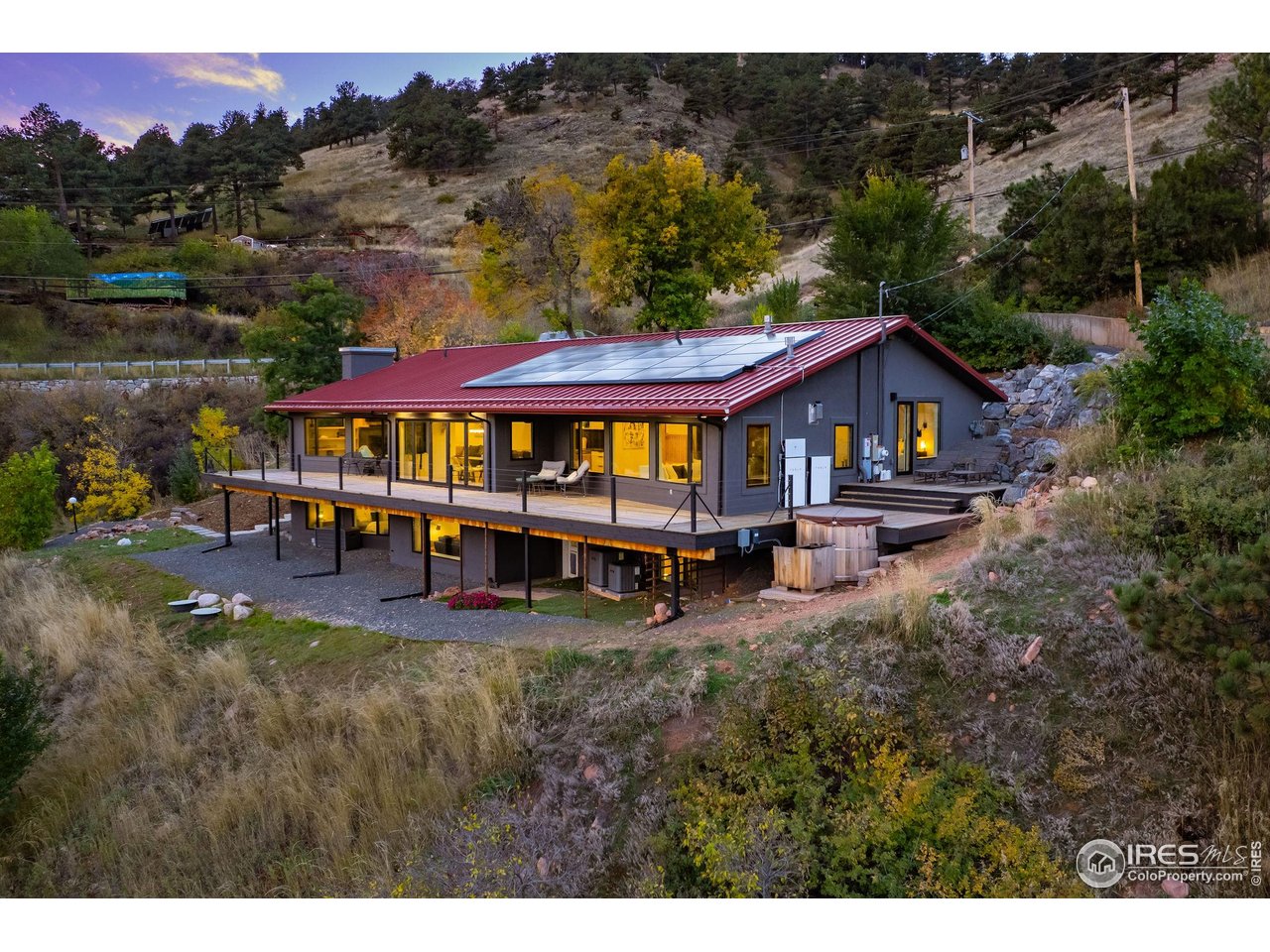 5880 Olde Stage Road Boulder, CO 80302 - Photo 6 of 50 a view of a house with swimming pool and sitting area