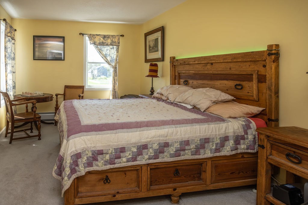 188 State Road Whately, MA 01373 - Photo 11 of 42 a bedroom with a bed and a dresser in it