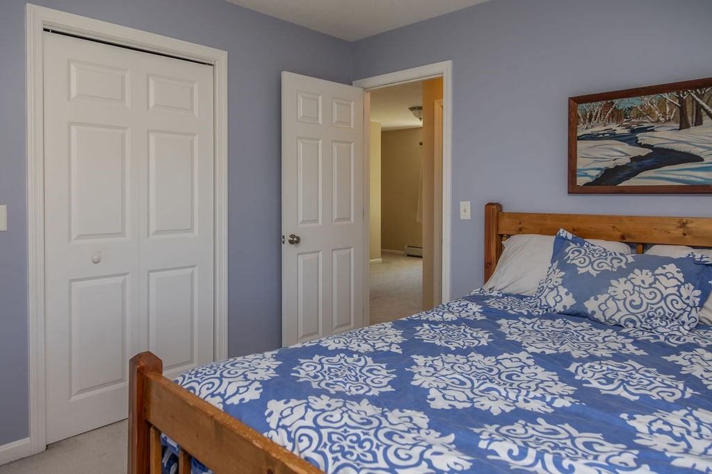 188 State Road Whately, MA 01373 - Photo 13 of 42 a bedroom with a bed and a painting on the wall