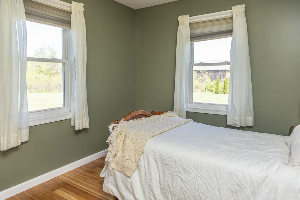 188 State Road Whately, MA 01373 - Photo 15 of 42 a bedroom with a bed and a window