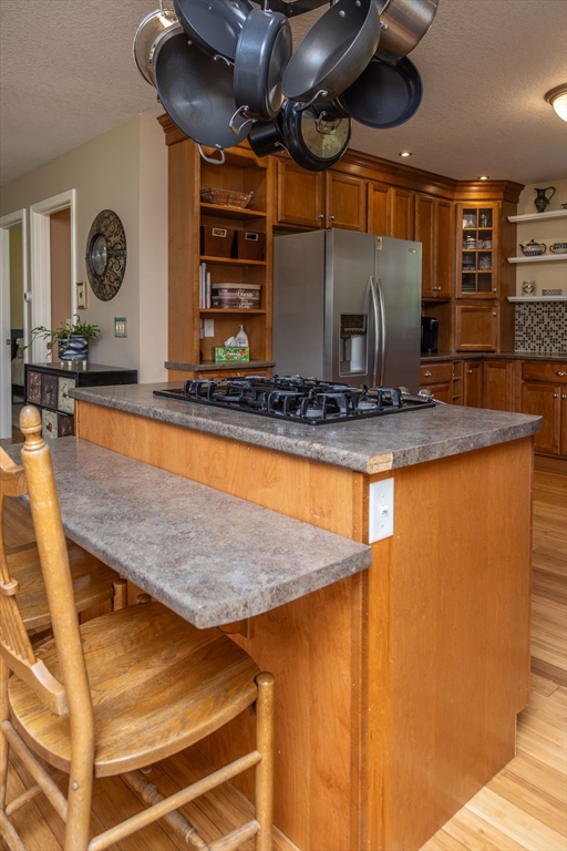 188 State Road Whately, MA 01373 - Photo 23 of 42 a kitchen with stainless steel appliances granite countertop a sink a stove and a wooden floors