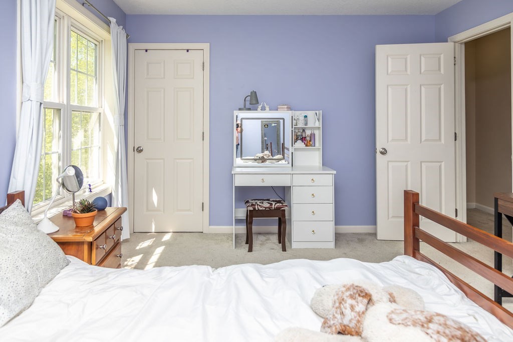 188 State Road Whately, MA 01373 - Photo 30 of 42 a bedroom with a bed and wooden floor