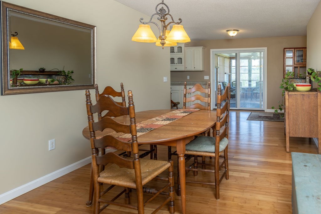 188 State Road Whately, MA 01373 - Photo 4 of 42 a view of a dining room with furniture and wooden floor