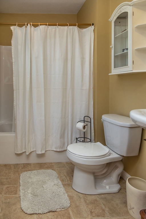 188 State Road Whately, MA 01373 - Photo 5 of 42 a white toilet sitting next to a bathroom sink