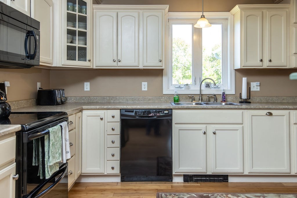 188 State Road Whately, MA 01373 - Photo 7 of 42 a kitchen with stainless steel appliances granite countertop white cabinets and a stove