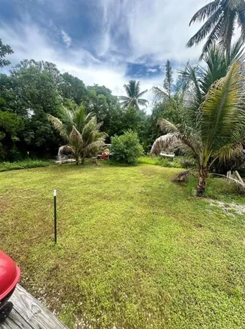 a view of a lake with a house in the background