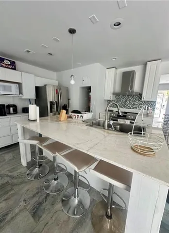 a room with lots of table and chairs