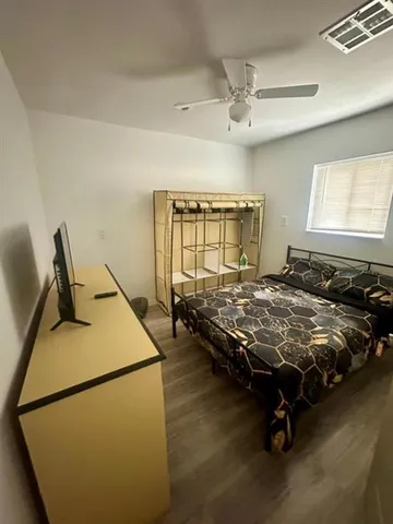 a bed sitting in a room next to a window