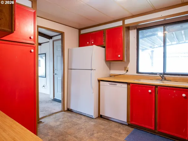 a view of a kitchen with a stove and a kitchen island