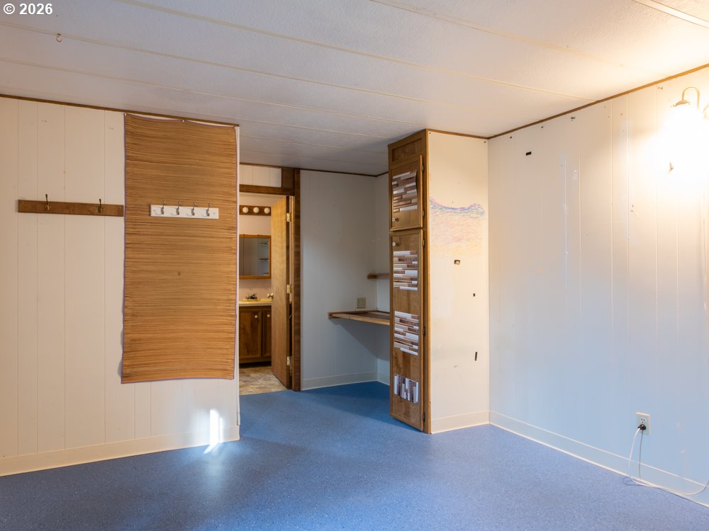 5335 Main Street Springfield, OR 97478 - Photo 17 of 43 a view of an empty room with a kitchen