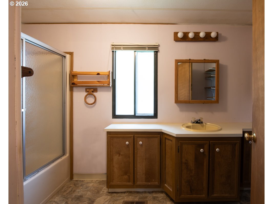 5335 Main Street Springfield, OR 97478 - Photo 20 of 43 a bathroom with a sink and a mirror