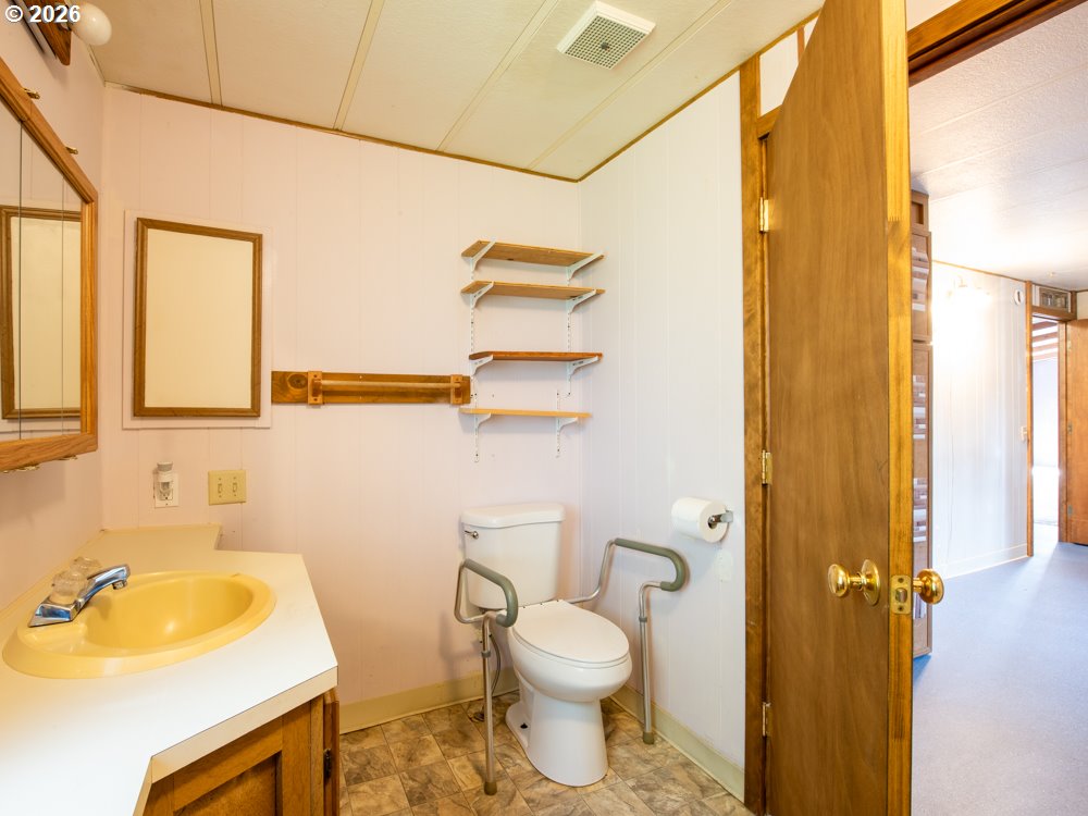 5335 Main Street Springfield, OR 97478 - Photo 21 of 43 a bathroom with a sink toilet and shower