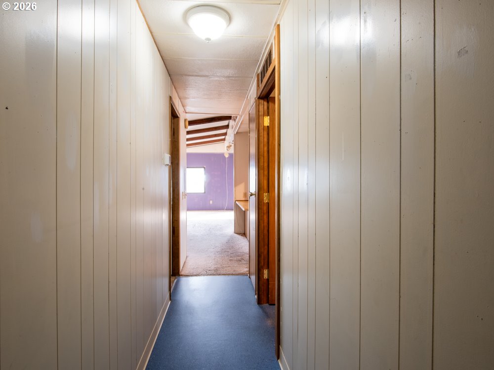 5335 Main Street Springfield, OR 97478 - Photo 25 of 43 a view of a hallway with wooden floor
